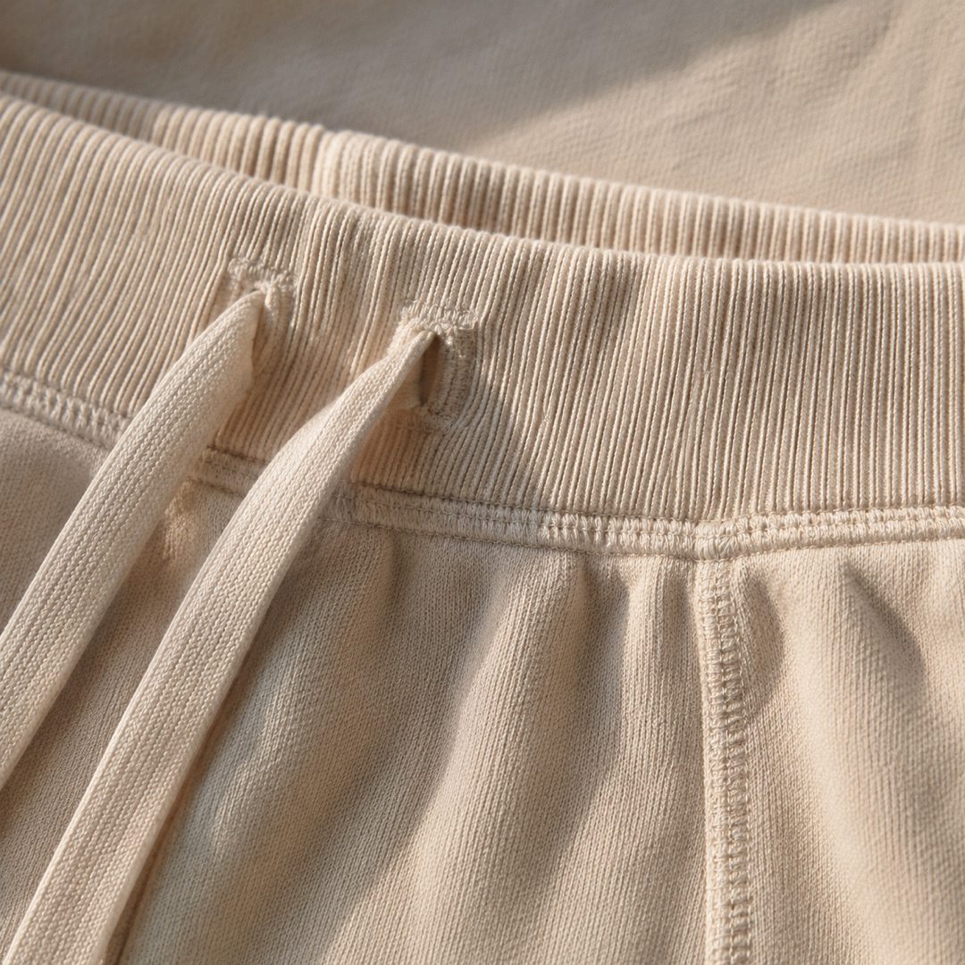 Fernhaugh wide-leg lounge trouser — Lounge Trousers by MOUDEST. close detail of the fabric and finish.